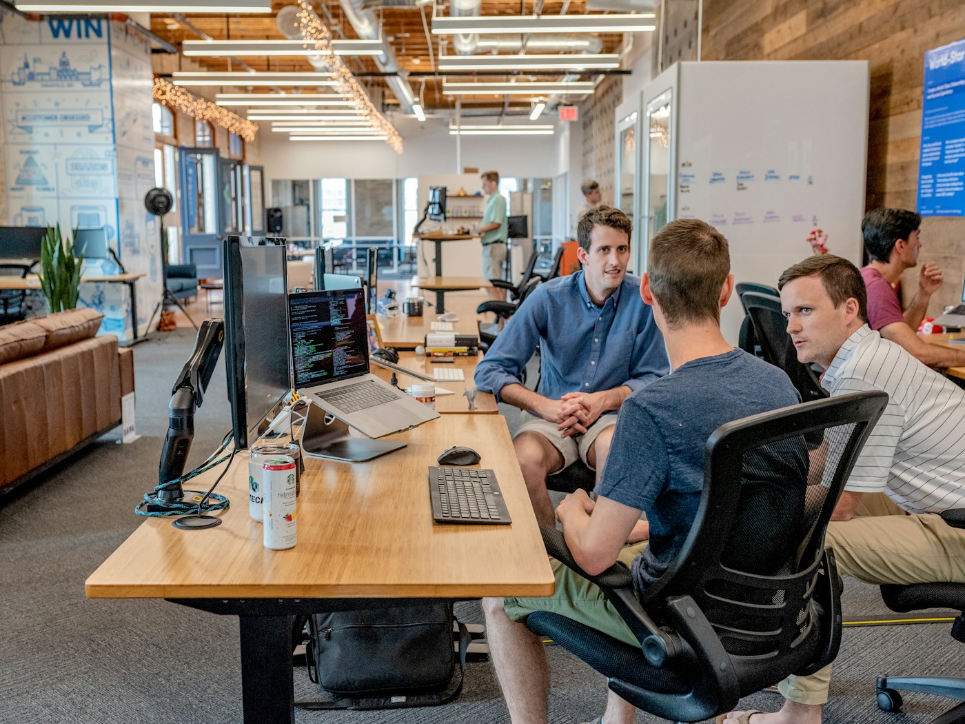 Professionals discussing a project around a meeting table